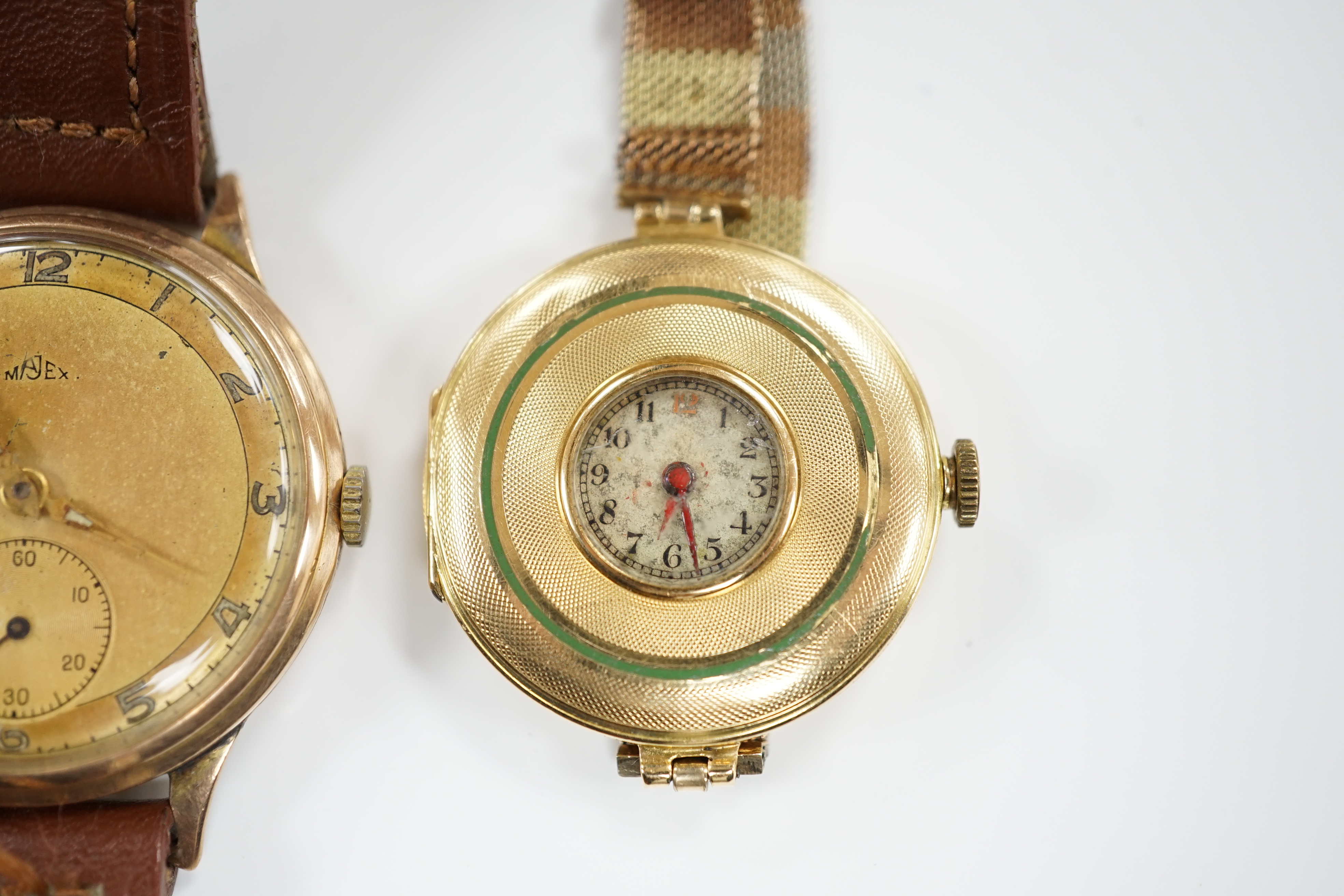 An early 20th century 18ct gold manual wind wrist watch, by Wilsdorf & Davies, on a later three colour 9ct mesh link bracelet and a gentleman's yellow metal Majex manual wind wrist watch, on a leather strap.